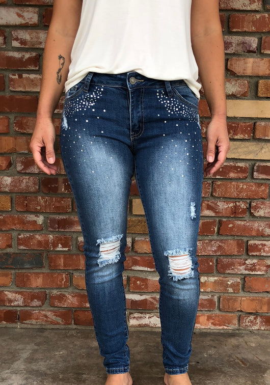 Distressed Rhinestone Pockets Skinny Jeans by Hammer   Take your outfit to the next level with OC Social Butterfly's hand selected, specially curated stylish pants. You can't go wrong a great pair of distressed skinny jeans, comfy joggers or linen pants.  Ships from the USA, unique style, fashion trends, comfortable jeans